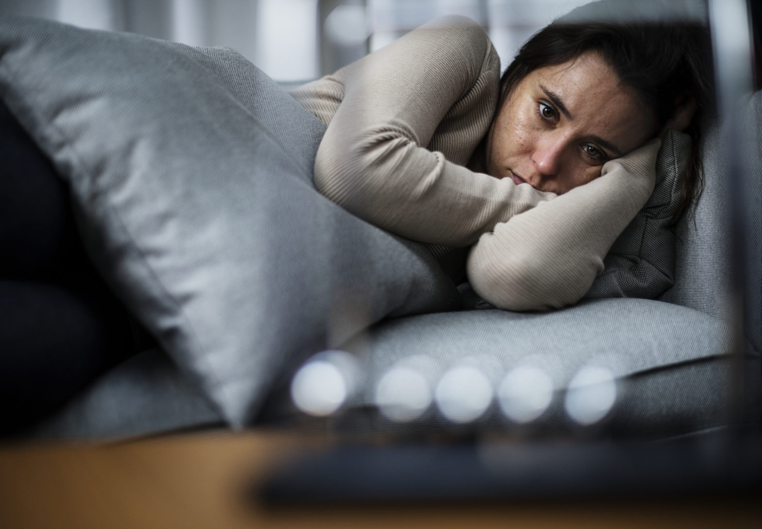 depressed woman lying down
